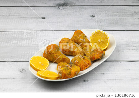 Pumpkin or Zucchini Flowers Dolma Stuffed with Rice Pilaf . Turkish Food in Plate. Traditional Organic Food. 130190716