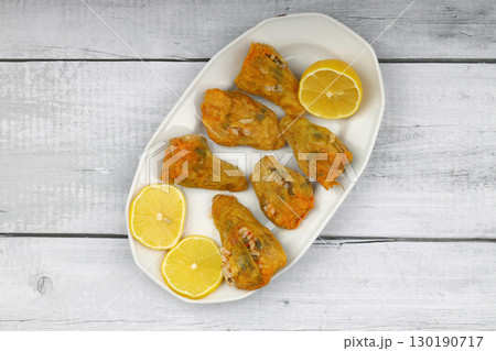Pumpkin or Zucchini Flowers Dolma Stuffed with Rice Pilaf . Turkish Food in Plate. Traditional Organic Food. 130190717