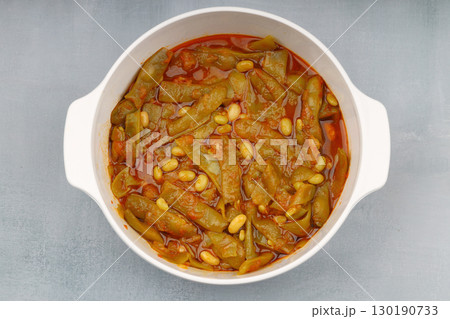 Homemade stewed green beans, tomatoes, garlic with olive oil. Zeytinyagli fasulye traditional food. Turkish cuisine. 130190733