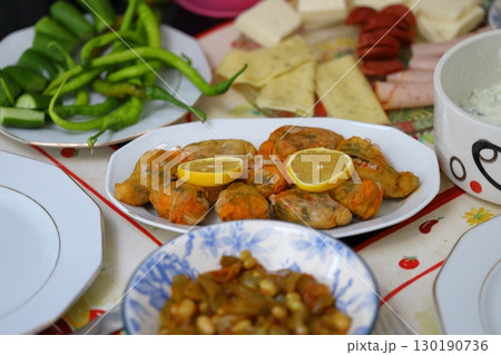 Pumpkin or Zucchini Flowers Dolma Stuffed with Rice Pilaf . Turkish Food in Plate. Traditional Organic Food. 130190736