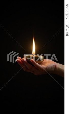 Minimalist Brass Diya Lighting Against Pure Black Background Symbolis. Dashahra, India. 130190900