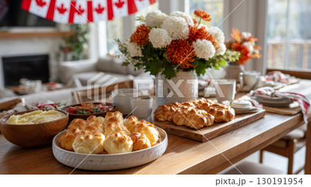 Beautifully arranged Thanksgiving table in Canada with seasonal decorations and delicious dishes for family gathering 130191954