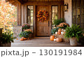 Traditional American porch beautifully adorned for Thanksgiving with autumn decorations and festive colors 130191984