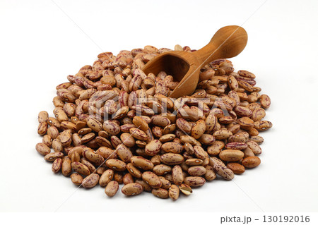 The heap of the red kidney beans isolated on a white background. With wooden scoop. 130192016