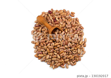 The heap of the red kidney beans isolated on a white background. With wooden scoop. 130192017