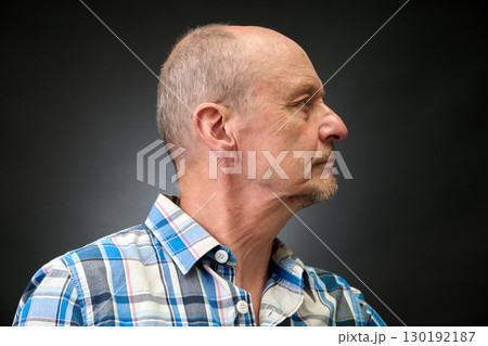 Closeup portrait of a senior man making funny faces 130192187