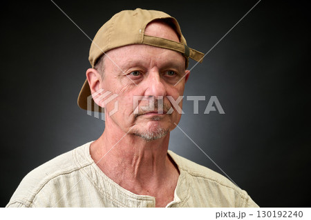 Closeup portrait of senior with a brown Cap Closeup portrait of senior with a brown Cap 130192240