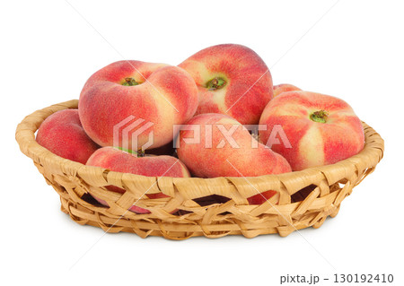 chinese flat donut peaches in a wicker basket isolated on white background chinese flat donut peaches in a wicker basket isolated on white background 130192410