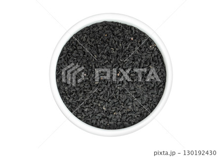 Nigella sativa or Black cumin in ceramic bowl isolated on white background. Top view. Flat lay. Nigella sativa or Black cumin in ceramic bowl isolated on white background. Top view. Flat lay. 130192430