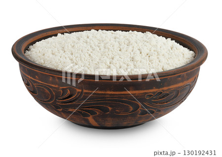 White flour in ceramic bowl isolated on white background 130192431