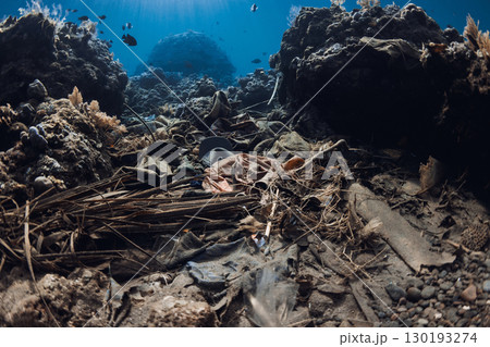 Underwater scene with pollution in corals. Tropical sea with transparent blue water Underwater scene with pollution in corals. Tropical sea with transparent blue water 130193274
