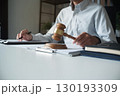 Legal justice man working on desk reading supportive documents to determine the consulting case 130193309