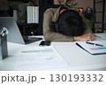 Overworked stressed businessman has headache pain while working in office. 130193332