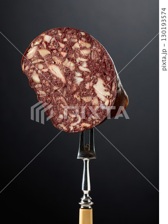 Black pudding or blood sausage on a fork. Black pudding or blood sausage on a fork. 130193574