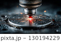 Laser cutting a round metal plate with bright sparks 130194229