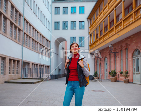 woman walks through old town of Frankfurt woman walks through old town of Frankfurt 130194794