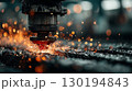 Industrial laser cutting metal with intense sparks 130194843
