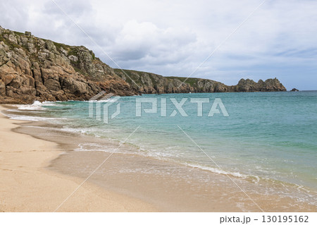 Porthcurno Beach, Cornwall UK with wide golden sand and clear Atlantic water 130195162