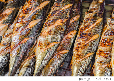 fried fish mackerel, street food, close-up, selective focus 130195304