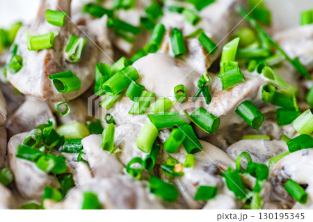 mushrooms in cream sauce with green onions, close-up, top view mushrooms in cream sauce with green onions, close-up, top view 130195345