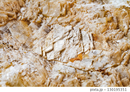 Icelandic spar layers in rock, close-up, selective focus 130195351