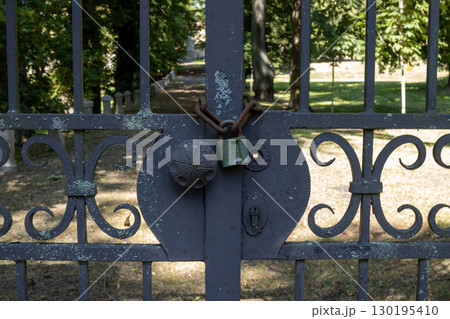 Closed gate with a padlock, Czech republic Closed gate with a padlock, Czech republic 130195410