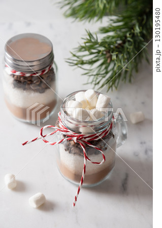 Christmas edible gift in mason jar for chocolate beverage on white background. 130195480