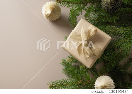 Christmas banner with craft gift, paper eco friendly gift and festive composition on beige background. 130195484