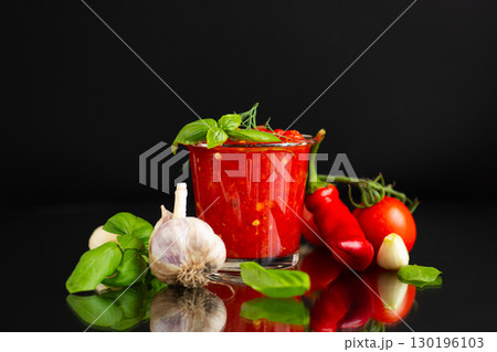 Tasty homemade sauce with garlic pepper and tomato Tasty homemade sauce with garlic pepper and tomato 130196103