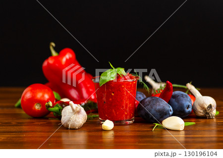 Tomato garlic sauce with basil in clear glass jar Tomato garlic sauce with basil in clear glass jar 130196104