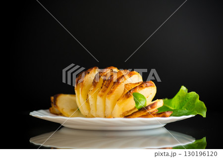 A hearty dish - potatoes from the oven with lard A hearty dish - potatoes from the oven with lard 130196120