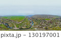 360 panoramic view of a canyon with a river and green slopes in misty weather 130197001