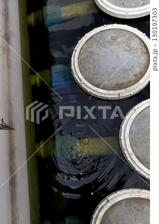 Aerator Diffuser in a Tank Actively Working to Enhance Water Aeration and Circulation Aerator Diffuser in a Tank Actively Working to Enhance Water Aeration and Circulation 130197303