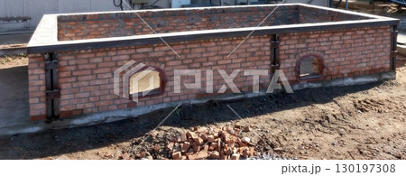 Brick Foundation Construction for an Outdoor Structure in a Sunny Area During Daytime Brick Foundation Construction for an Outdoor Structure in a Sunny Area During Daytime 130197308