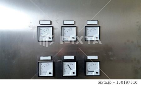 Cabinet Panel Displaying Multiple Ammeters for Electrical Current Measurement Cabinet Panel Displaying Multiple Ammeters for Electrical Current Measurement 130197310