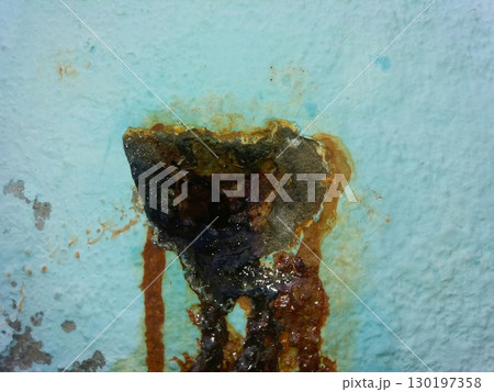 Rusty Leak in Wall Reveals Damage and Corrosion Over Time in an Indoor Setting 130197358