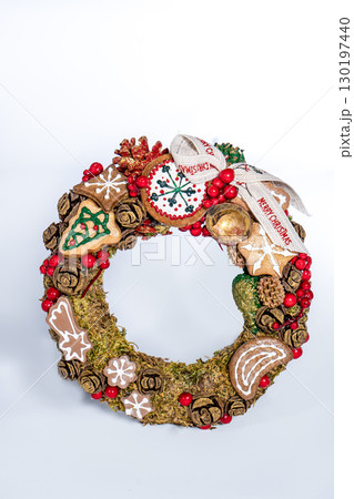Christmas wreath candle candle gingerbread tree white snow isolated 130197440