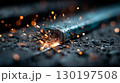 Metal grinding with intense sparks in a workshop 130197508