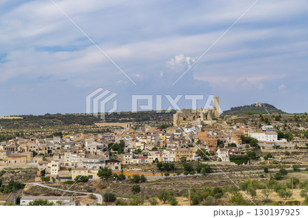 Ciutadilla, Spain, panoramic view of the medieval castle dominating the village under a cloudy sky Ciutadilla, Spain, panoramic view of the medieval castle dominating the village under a cloudy sky 130197925