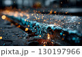 Welding sparks on a metal beam in an industrial setting 130197966
