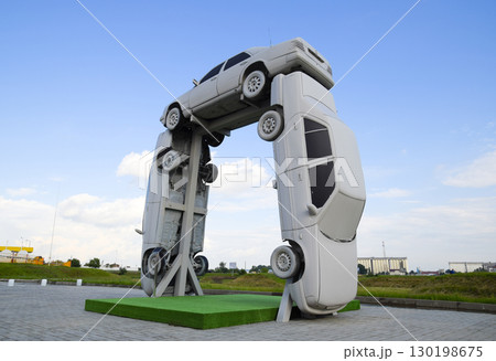 Homemade sculpture of three cars. Monument to the cyrillic lette Homemade sculpture of three cars. Monument to the cyrillic lette 130198675