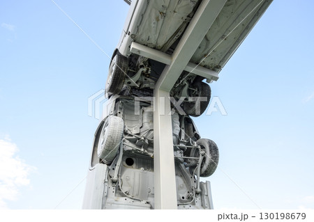 Homemade sculpture of three cars. Monument to the cyrillic lette 130198679