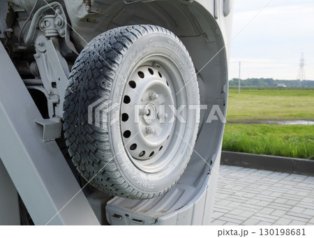Homemade sculpture of three cars. Monument to the cyrillic lette 130198681