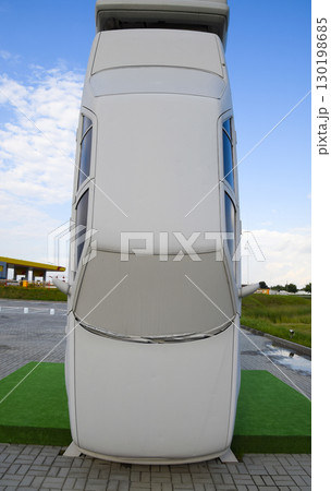 Homemade sculpture of three cars. Monument to the cyrillic lette 130198685