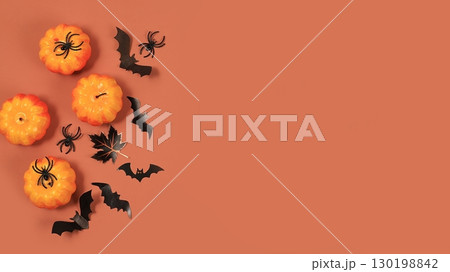Happy halloween concept, background with place for text, pumpkins, spiders and bats top view, greeting card or banner, template for design, selective focus 130198842