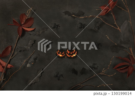 Happy halloween concept, background with congratulations, pumpkins, spiders and bats top view, greeting card or banner, template for design, selective focus 130199014