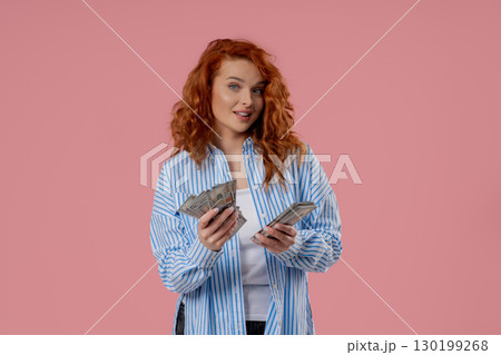 Rich Ginger Woman Counting Usd Cash Money Dollars On Pink,Income payment, salary Rich Ginger Woman Counting Usd Cash Money Dollars On Pink,Income payment, salary 130199268