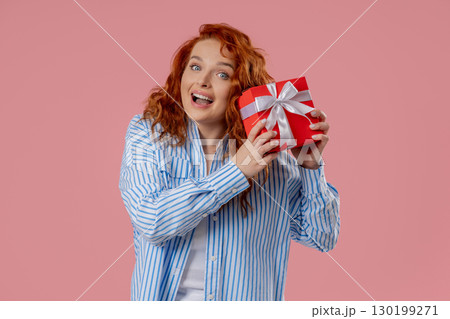 Grateful Woman With Gift Box On pink. Confused Lady Smiling, Present, Surprise Grateful Woman With Gift Box On pink. Confused Lady Smiling, Present, Surprise 130199271