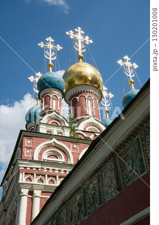 Ornate domes of the Assumption Church (Uspenskaya) in Taganka district, Moscow, with gleaming golden and blue cupolas crowned by Orthodox crosses 130201008