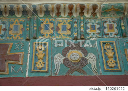 Ornate ceramic tilework featuring a winged seraphim face, floral motifs, and Orthodox Christian symbols in rich green, yellow, blue, and red tones 130201022